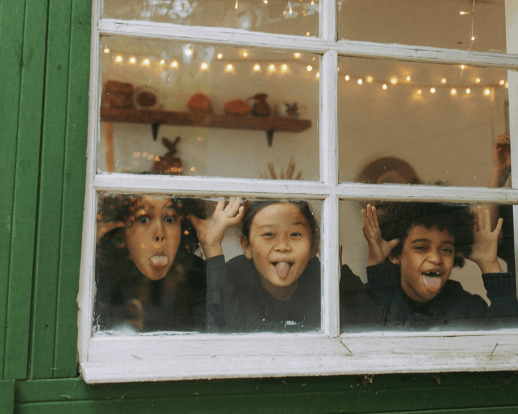 The Foster Alliance Holiday Toy Drive 2025 - Children looking out window promoting pajama donations